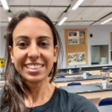 Kammy Algiers smiling in her lab classroom.